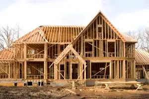 Large McMansion type house under construction in framing phase